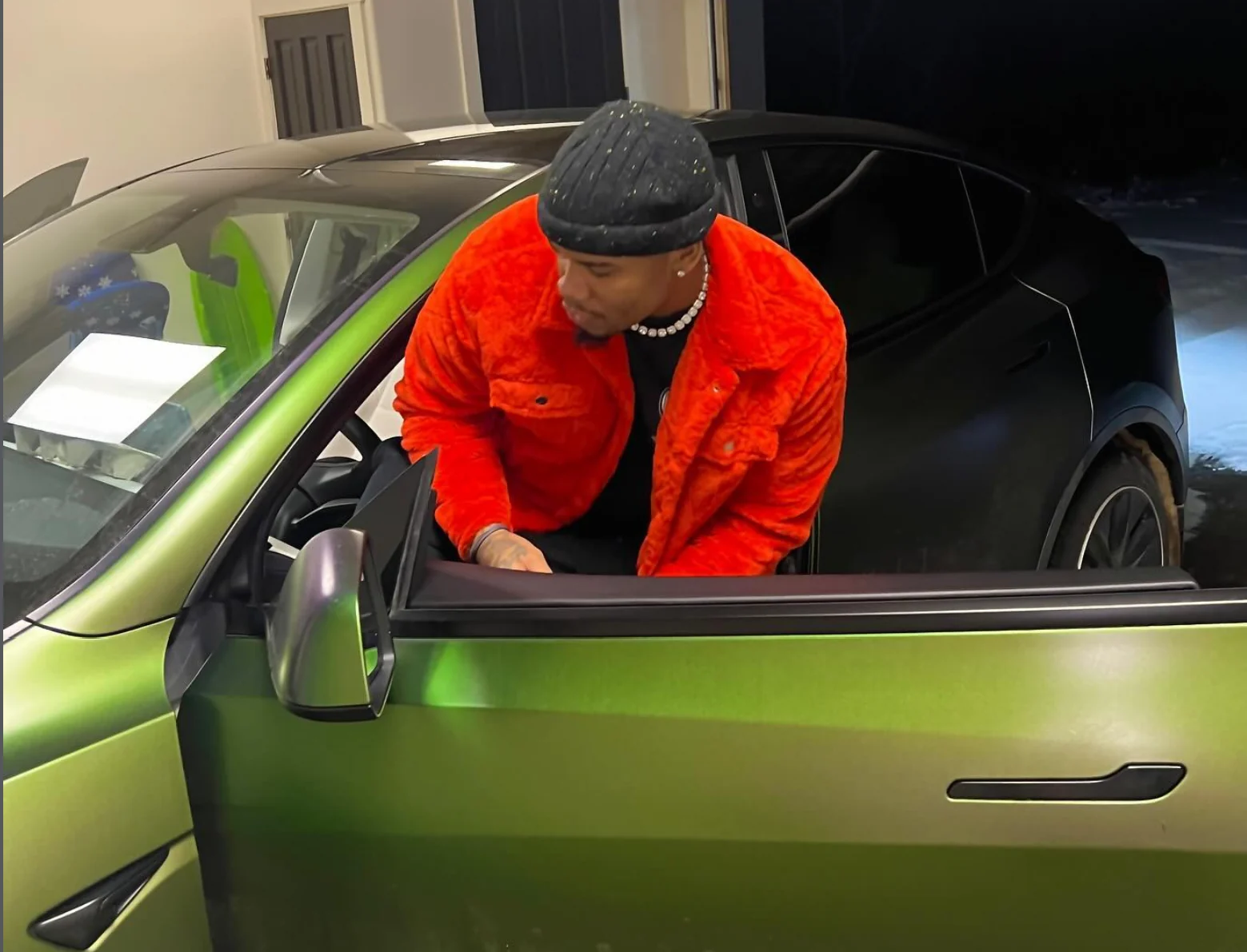 Ant CEO with a green car