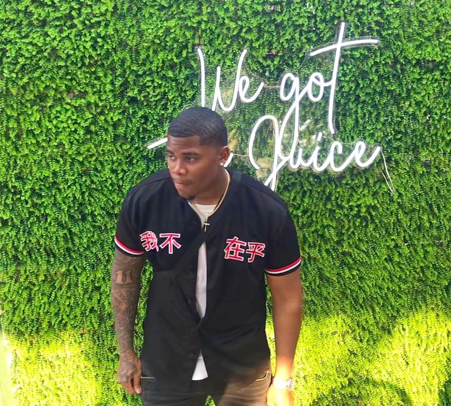 Ant CEO in front of a green wall